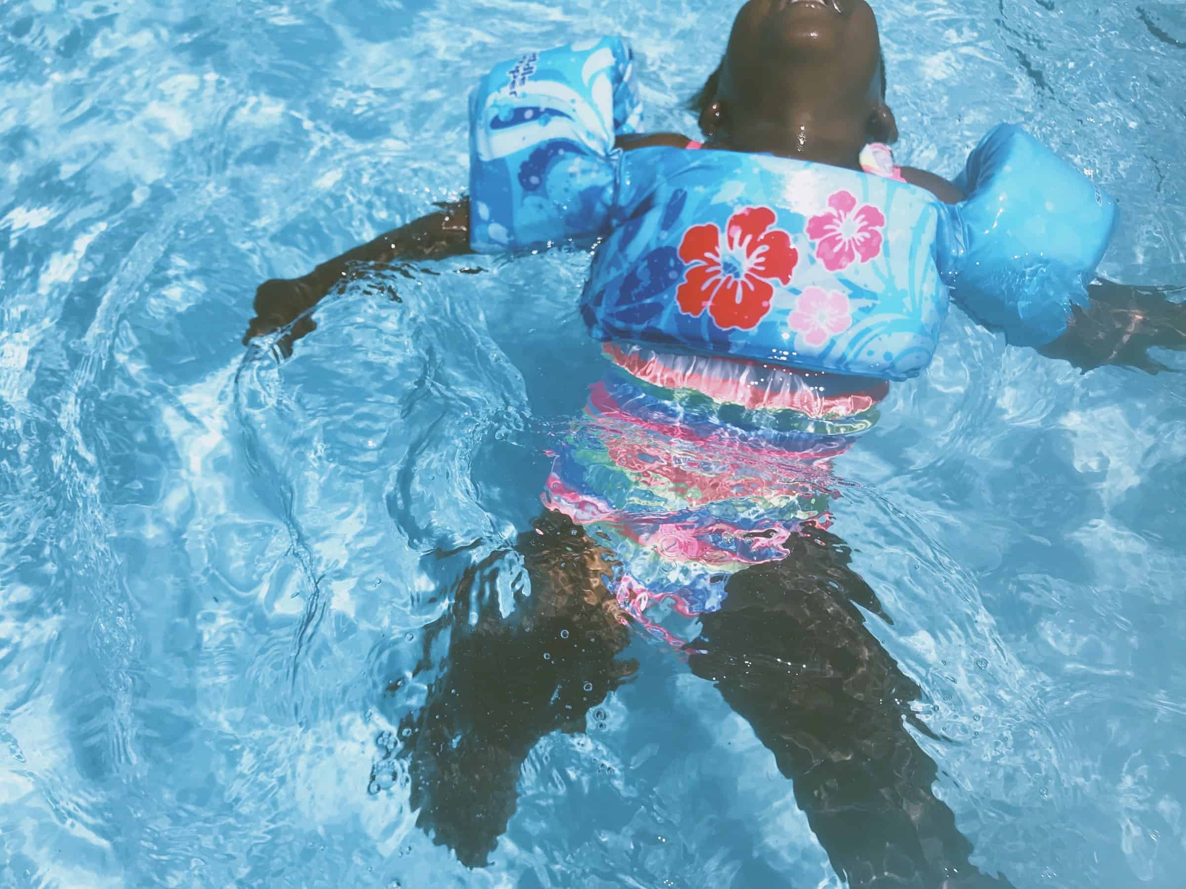 Boy and store girl matching swimwear