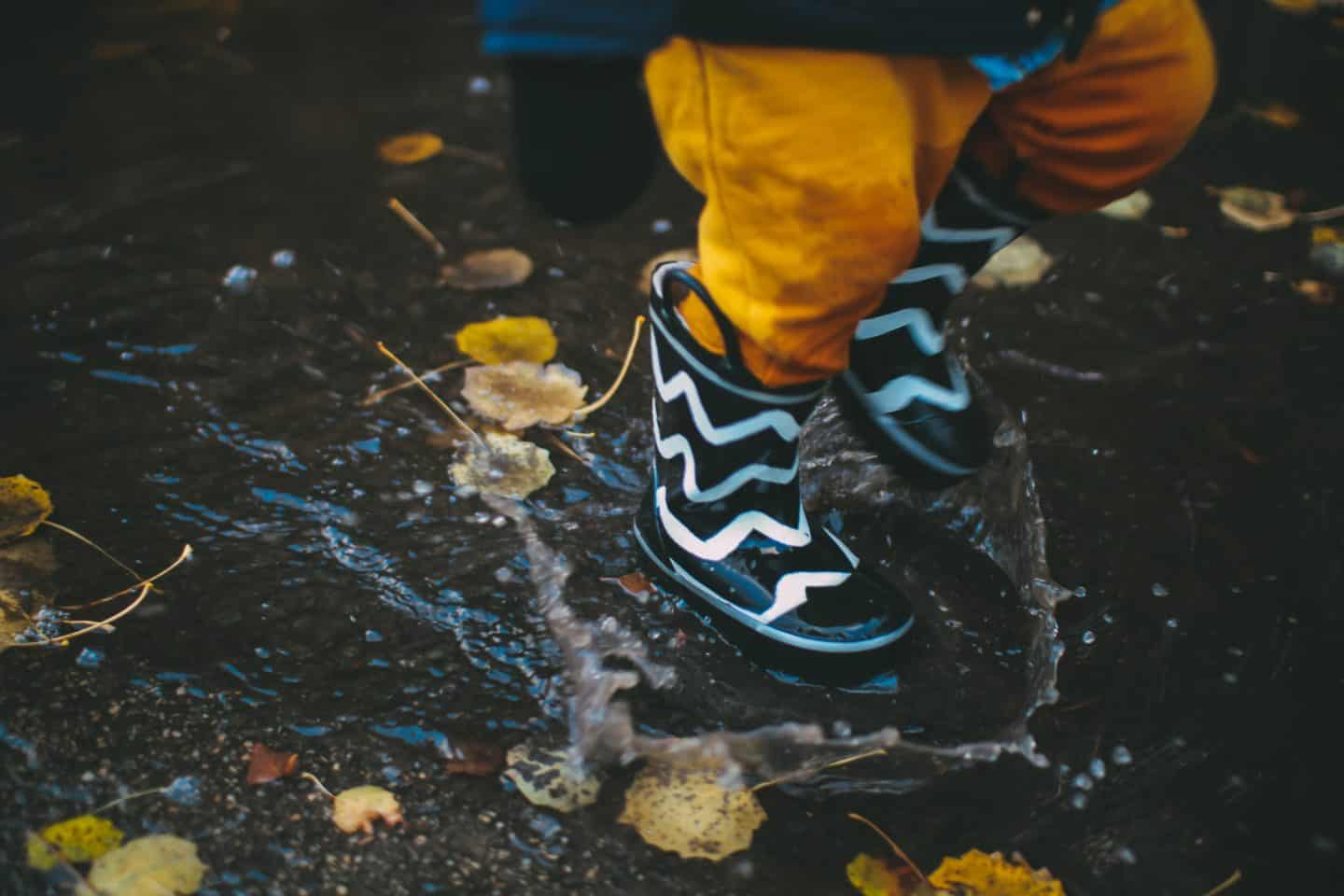 best twin boy and girl matching outfits, rainboots splashing in puddles